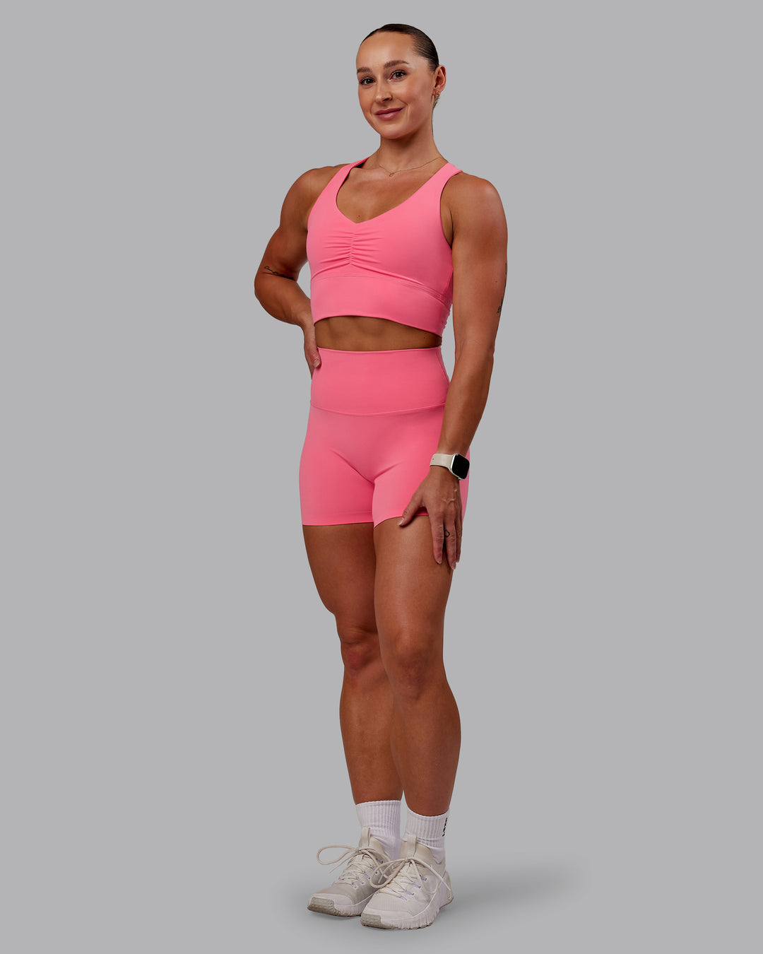 Woman wearing Evoke Sports Bra in Pink Lemonade | Size:S - view 5