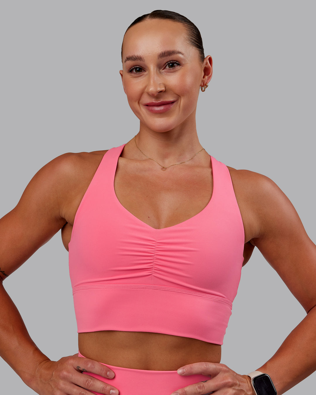 Woman wearing Evoke Sports Bra in Pink Lemonade | Size:S - view 3