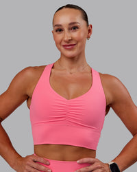 Woman wearing Evoke Sports Bra in Pink Lemonade | Size:S | Thumbnail Index: 2