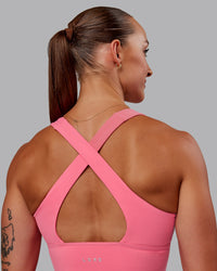 Woman wearing Evoke Sports Bra in Pink Lemonade | Size:S | Thumbnail Index: 1