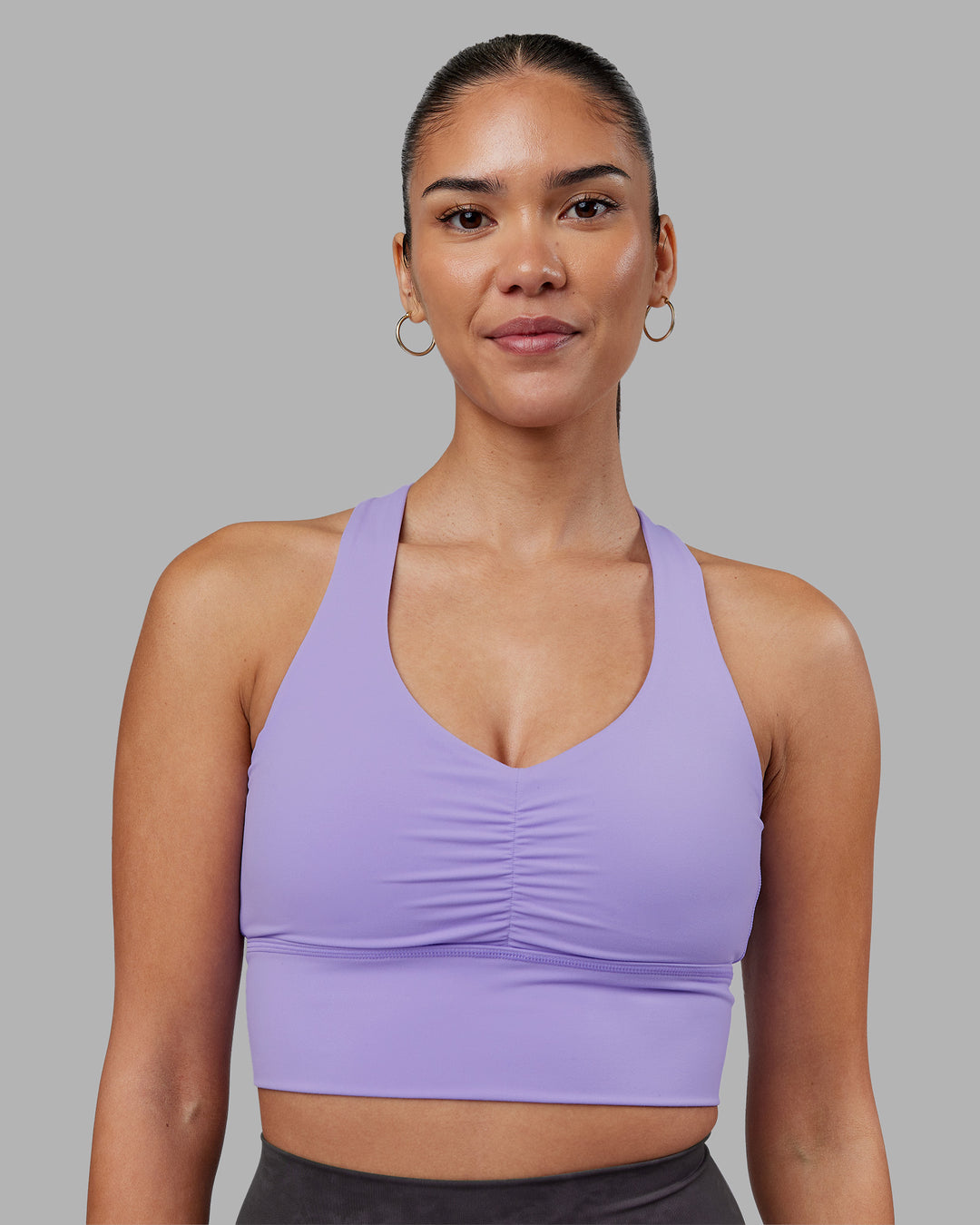 Woman wearing Evoke Longline Sports Bra - Violet Ray | Model:Rhiley | Size:S - view 5