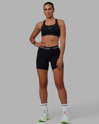 Woman wearing Extend Mid-Rise 6" Short - Black-White | Thumbnail Index: 6