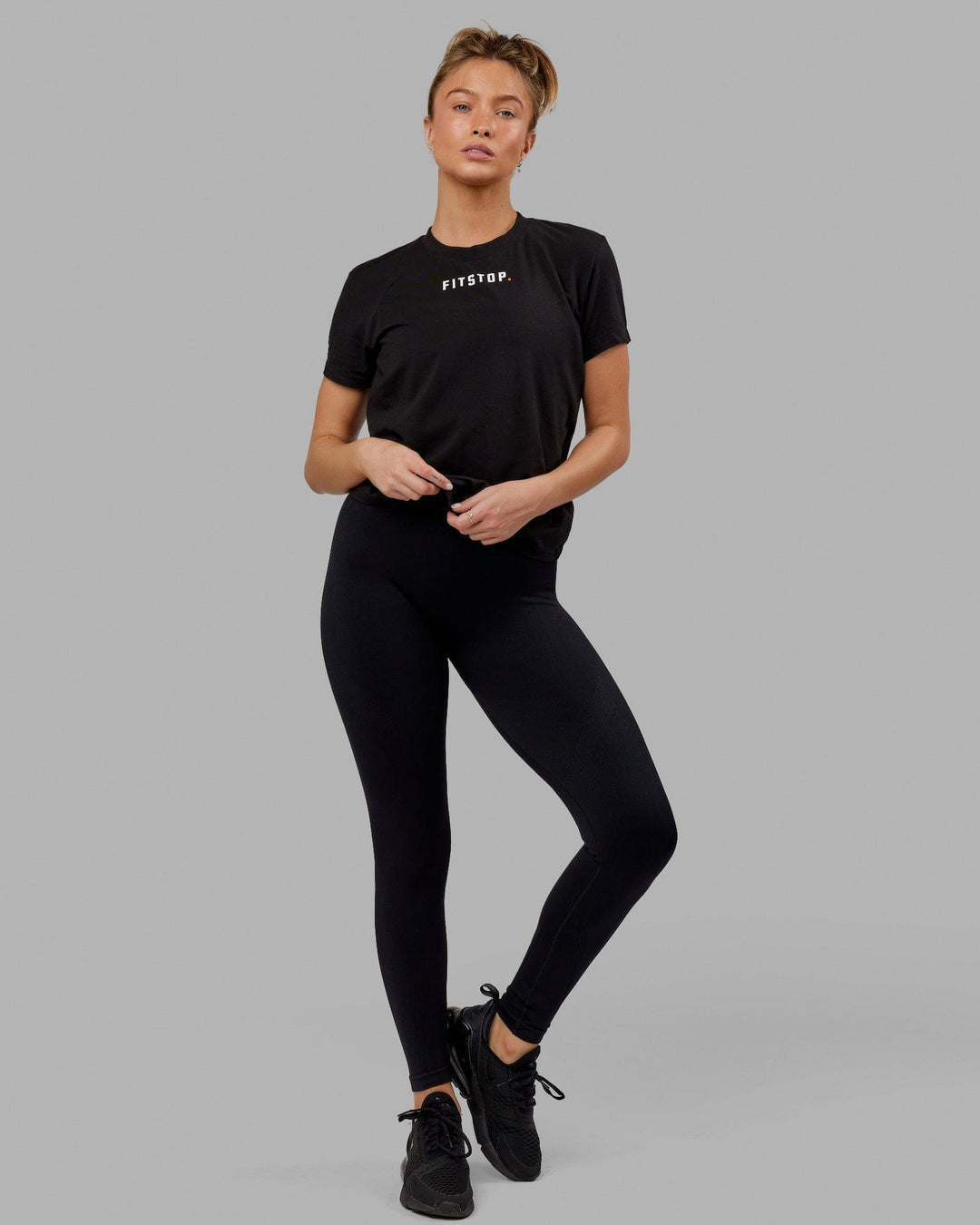 Woman wearing Fitstop Fast Tee - Black - view 2
