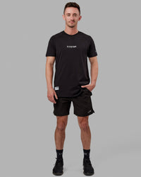 Man wearing Fitstop Optimal Tee - Black | Thumbnail Index: 1