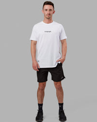 Man wearing Fitstop Optimal Tee - White | Thumbnail Index: 1