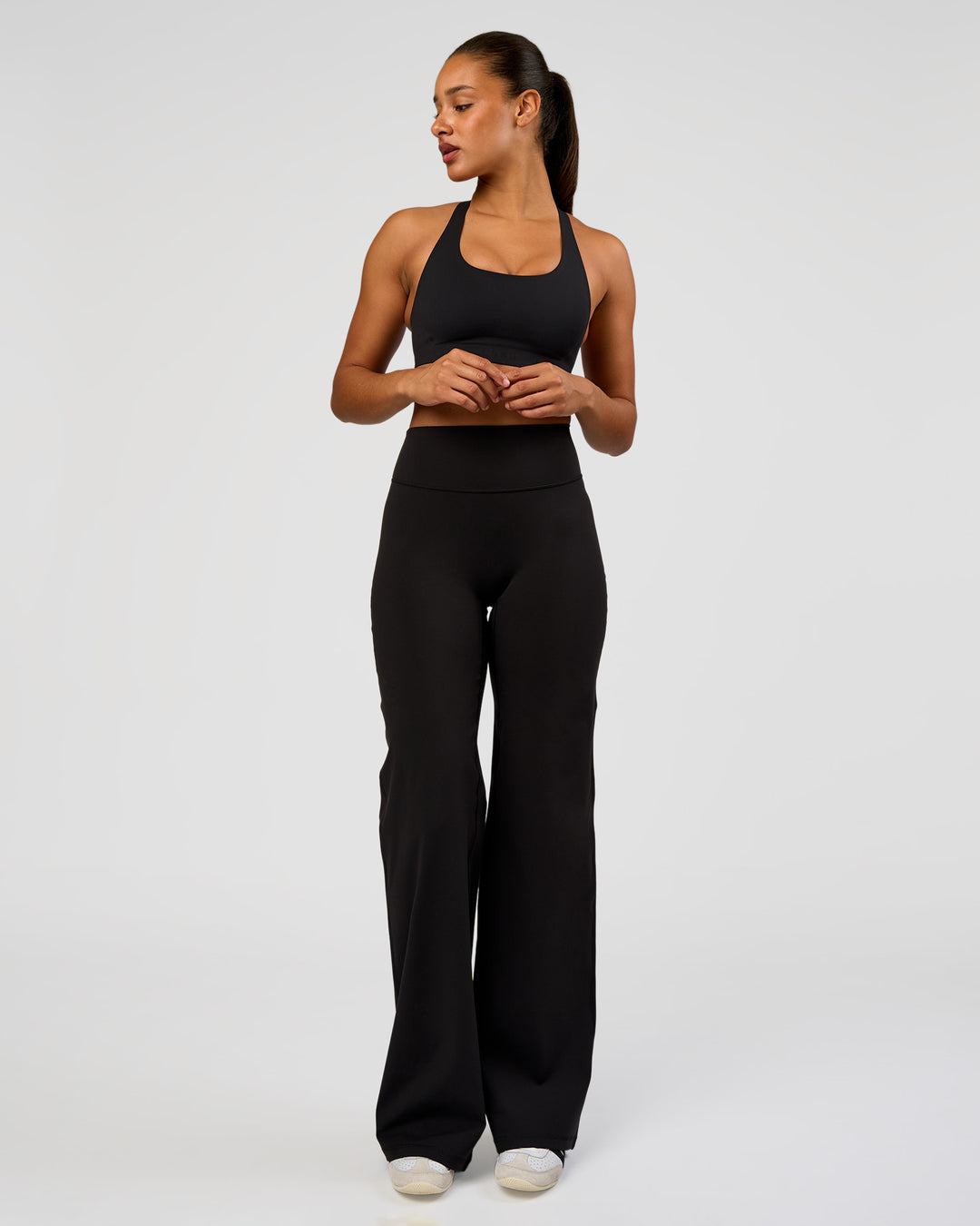 Woman wearing Flow Bonded Scoop Neck Sports Bra - Black | Model:Rosie | Size:S - view 4
