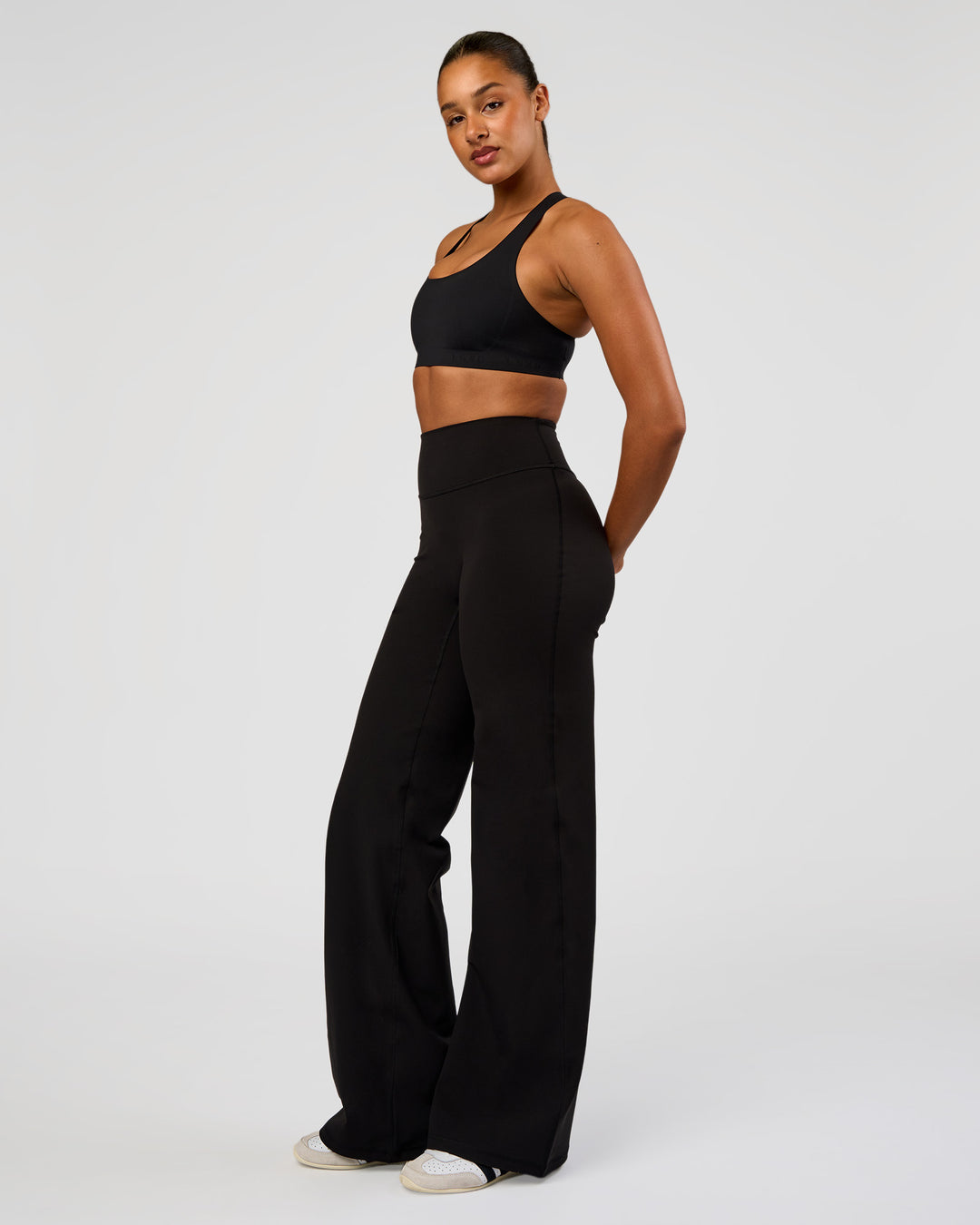 Woman wearing Flow Bonded Scoop Neck Sports Bra - Black | Model:Rosie | Size:S - view 5