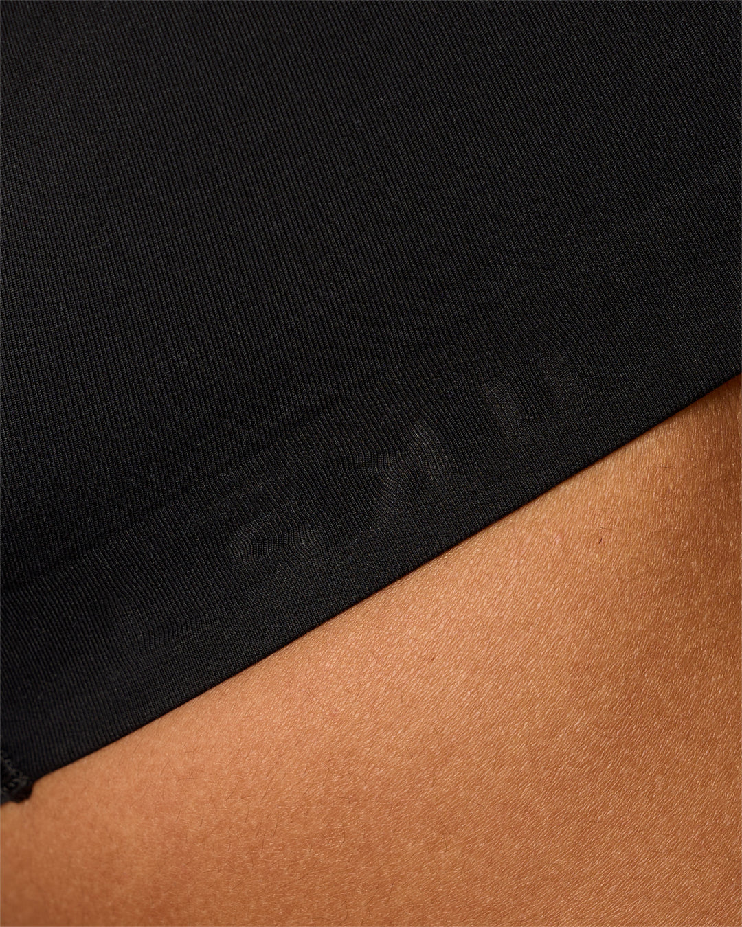 Woman wearing Flow Bonded Scoop Neck Sports Bra - Black | Model:Rosie | Size:S - view 3