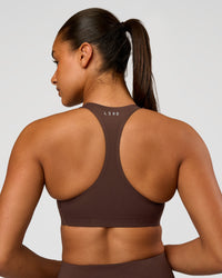 Woman wearing Flow Bonded Scoop Neck Sports Bra - Hot Chocolate | Model:Rosie | Size:S | Thumbnail Index: 0