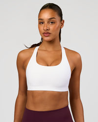 Woman wearing Flow Bonded Scoop Neck Sports Bra - White | Model:Rosie | Size:S | Thumbnail Index: 0