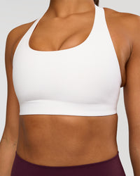 Woman wearing Flow Bonded Scoop Neck Sports Bra - White | Model:Rosie | Size:S | Thumbnail Index: 3