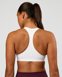 Woman wearing Flow Bonded Scoop Neck Sports Bra - White | Model:Rosie | Size:S | Thumbnail Index: 1