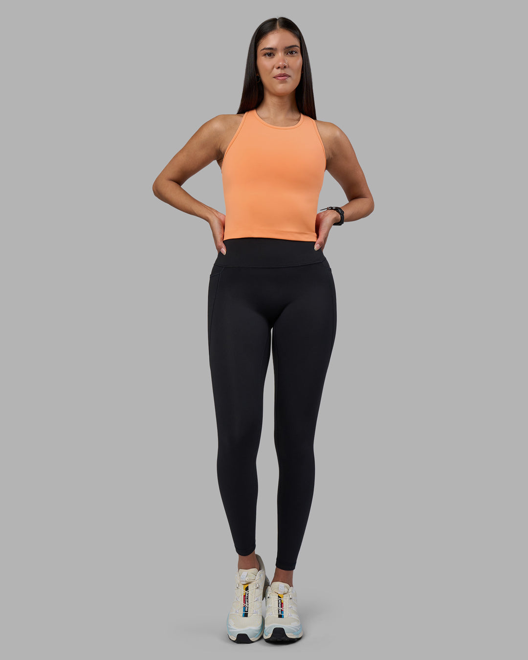 Woman wearing Flow Performance Tank 2.0 - Cantaloupe | Model:Rhiley | Size:S - view 3