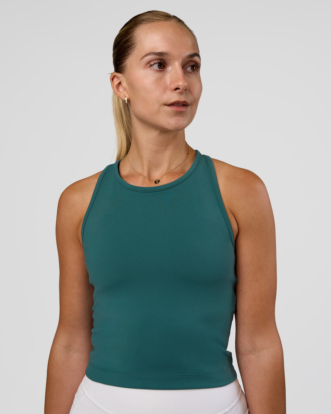 Woman wearing Flow Performance Tank 2.0 - Transformative Teal | Model:Myrte | Size:S - view 3