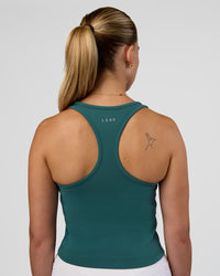 Woman wearing Flow Performance Tank 2.0 - Transformative Teal | Model:Myrte | Size:S | Thumbnail Index: 1