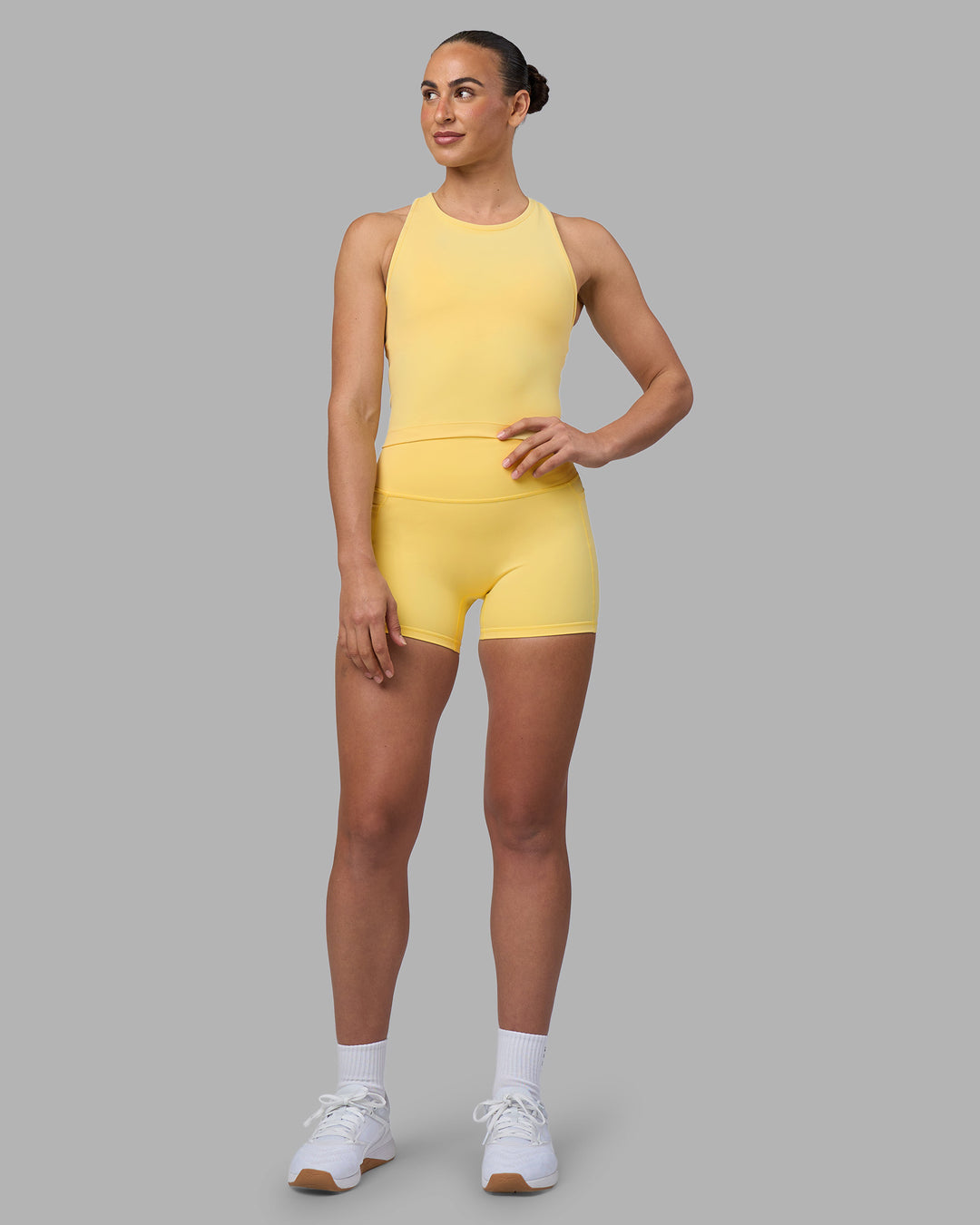 Woman wearing Flow Performance Tank 2.0 - Lemon | Model:Sophie | Size:S - view 2