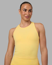 Woman wearing Flow Performance Tank 2.0 - Lemon | Model:Sophie | Size:S | Thumbnail Index: 0