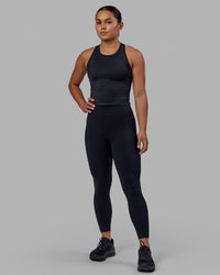 Woman wearing Flow Performance Tank - Black | Thumbnail Index: 3