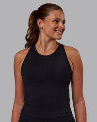 Woman wearing Flow Performance Tank - Black | Model:Phoebe | Size:S | Thumbnail Index: 0