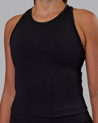 Woman wearing Flow Performance Tank - Black | Model:Phoebe | Size:S | Thumbnail Index: 3