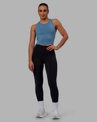 Woman wearing Flow Performance Tank - Elemental Blue | Thumbnail Index: 5