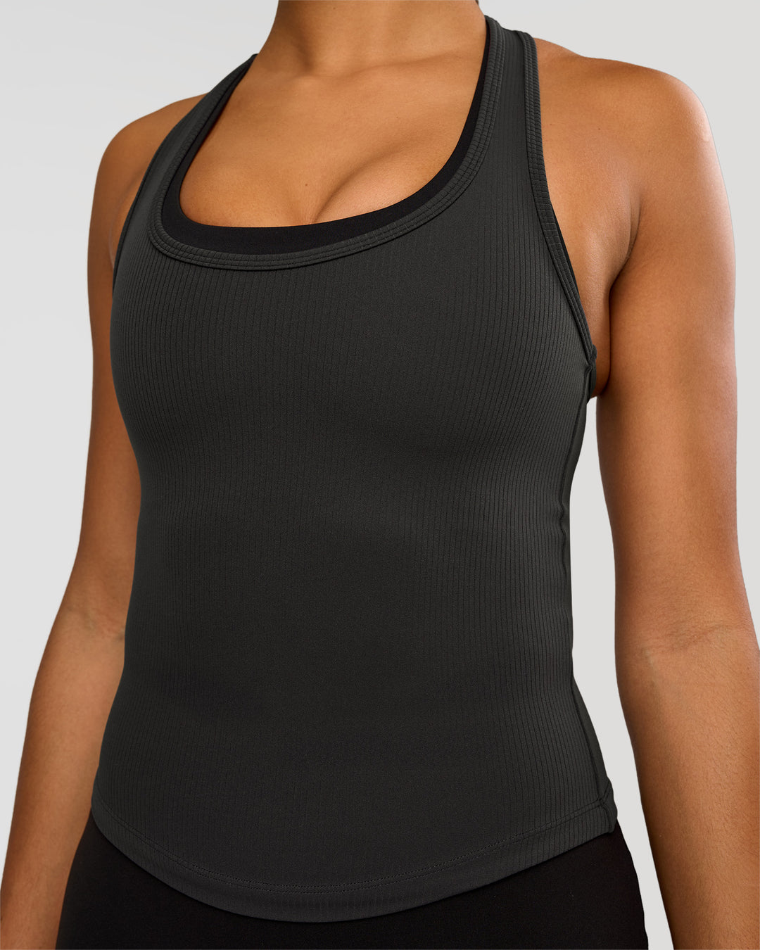 Woman wearing Flow Rib Scoop Neck Tank - Onyx | Model:Rosie | Size:S - view 1