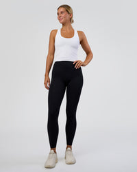 Woman wearing Flow Scoop Neck Performance Tank - White | Model:Amity | Size:S | Thumbnail Index: 4