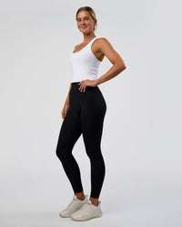 Woman wearing Flow Scoop Neck Performance Tank - White | Model:Amity | Size:S | Thumbnail Index: 3