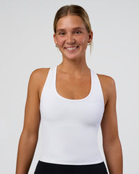 Woman wearing Flow Scoop Neck Performance Tank - White | Model:Amity | Size:S | Thumbnail Index: 0