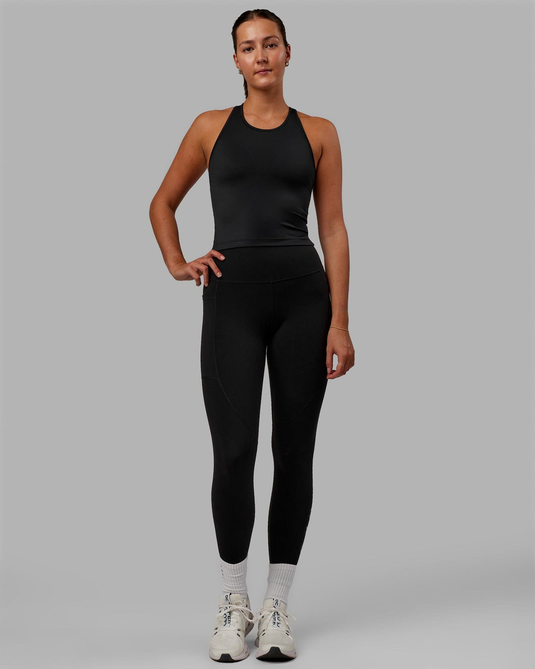 Woman wearing Flow Shelf Bra Performance Tank - Black - view 6