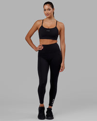 Woman wearing Flux Ultra High-Rise Full Length Legging Pockets - Black | Thumbnail Index: 7