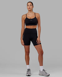 Woman wearing Flux Ultra High-Rise 6" Short Pockets - Black | Thumbnail Index: 10
