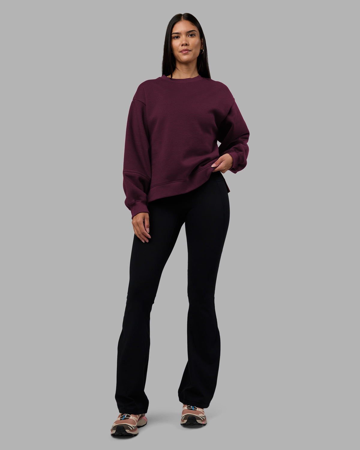 Woman wearing Full Form Fleece Sweater with Side Slits - Cherry Lacquer | Model:Rhiley | Size:S
