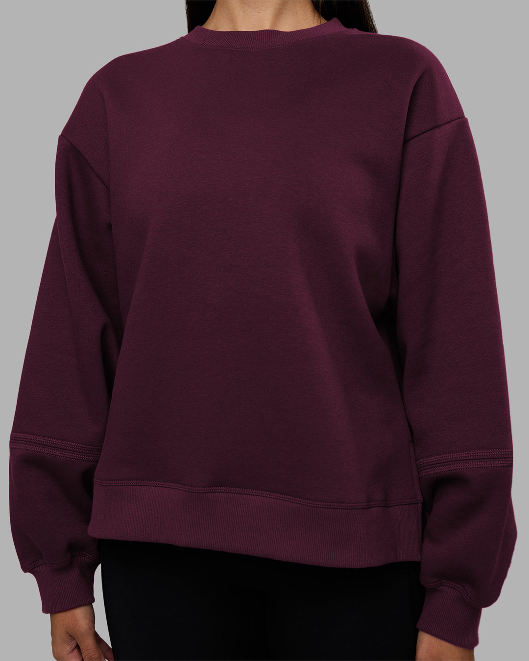 Woman wearing Full Form Fleece Sweater with Side Slits - Cherry Lacquer | Model:Rhiley | Size:S - view 7