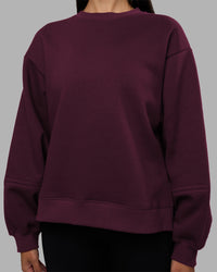 Woman wearing Full Form Fleece Sweater with Side Slits - Cherry Lacquer | Model:Rhiley | Size:S | Thumbnail Index: 6