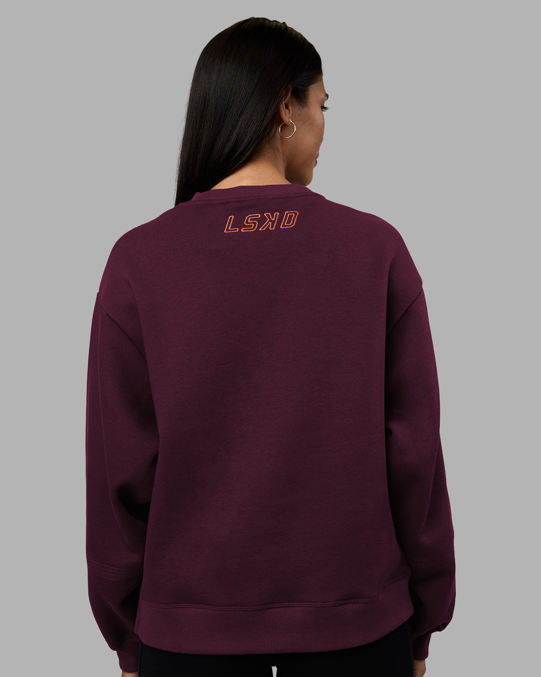 Woman wearing Full Form Fleece Sweater with Side Slits - Cherry Lacquer | Model:Rhiley | Size:S - view 4