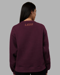 Woman wearing Full Form Fleece Sweater with Side Slits - Cherry Lacquer | Model:Rhiley | Size:S | Thumbnail Index: 3
