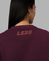 Woman wearing Full Form Fleece Sweater with Side Slits - Cherry Lacquer | Model:Rhiley | Size:S | Thumbnail Index: 1