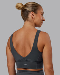 Woman wearing Function Longline Sports Bra in Dark Storm | Size:S | Thumbnail Index: 5