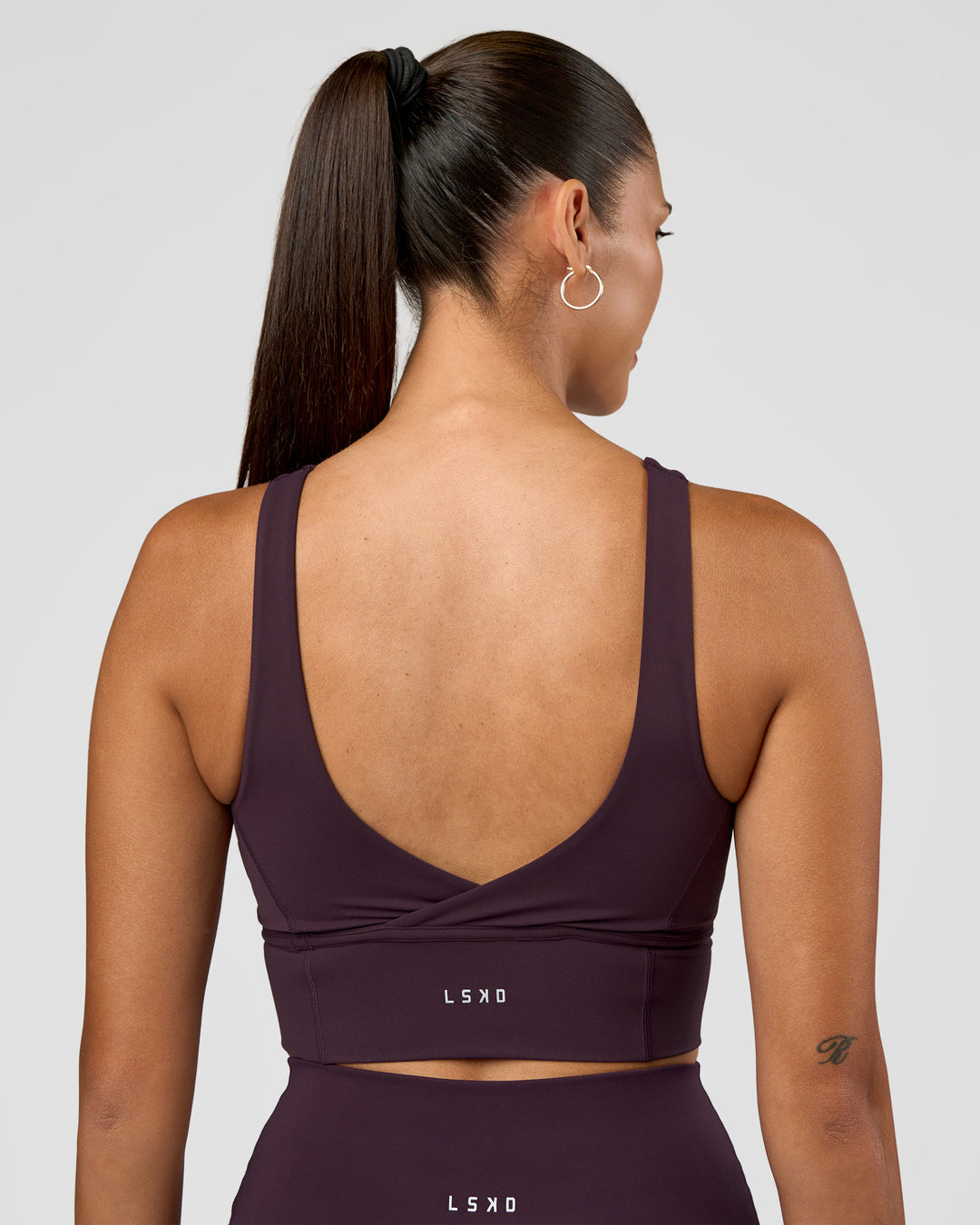 Woman wearing Function Longline Sports Bra - Midnight Plum | Model:Rhiley | Size:S - view 2