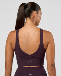 Woman wearing Function Longline Sports Bra - Midnight Plum | Model:Rhiley | Size:S | Thumbnail Index: 1