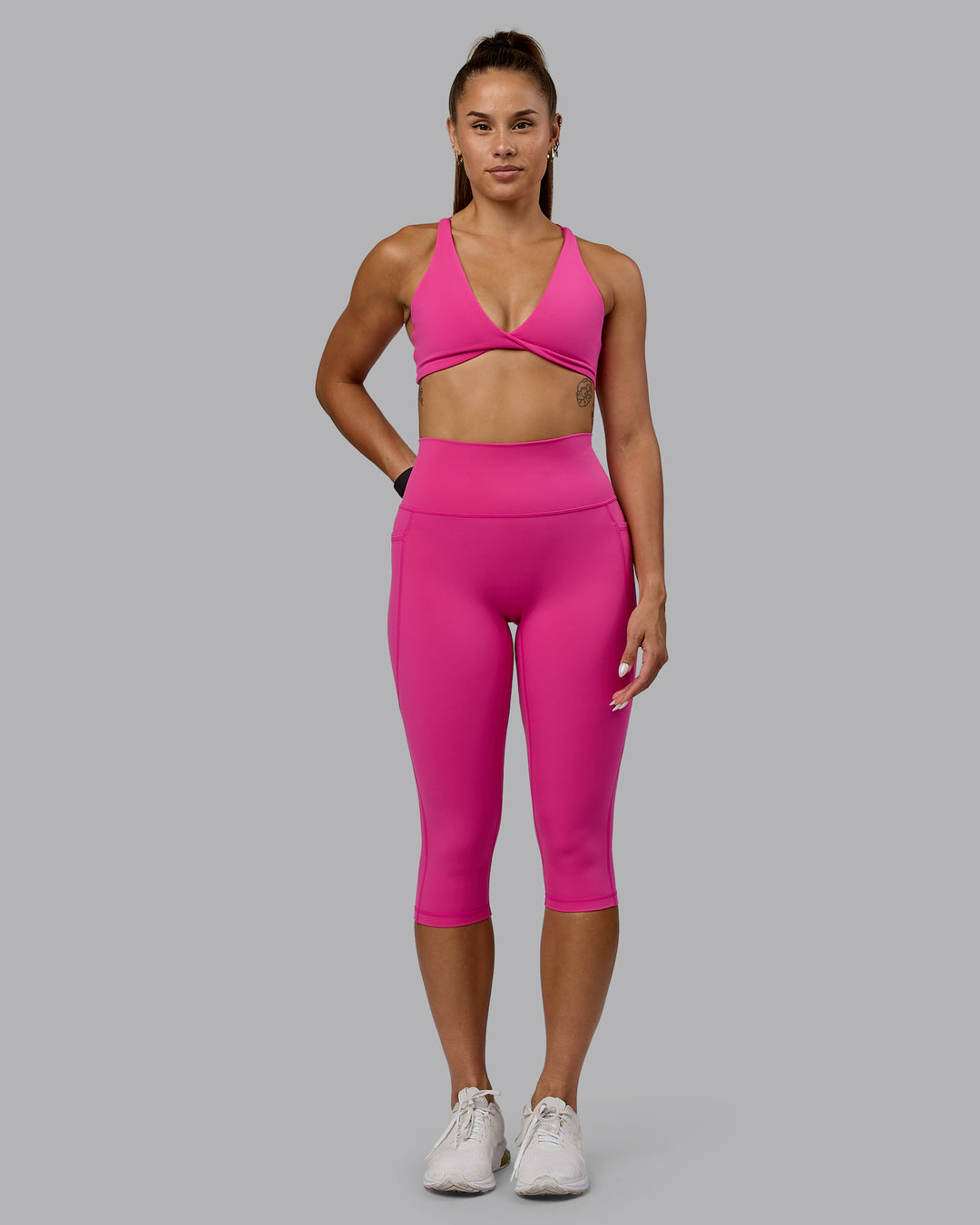 Woman wearing Fusion Ultra High-Rise 3/4 Legging Pockets - Fuchsia Pink | Model:Vanessa | Size:S - view 4