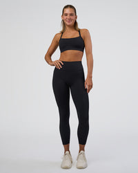 Woman wearing Fusion Ultra High-Rise 7/8 Legging Pockets - Black | Model:Amity | Size:S | Thumbnail Index: 1