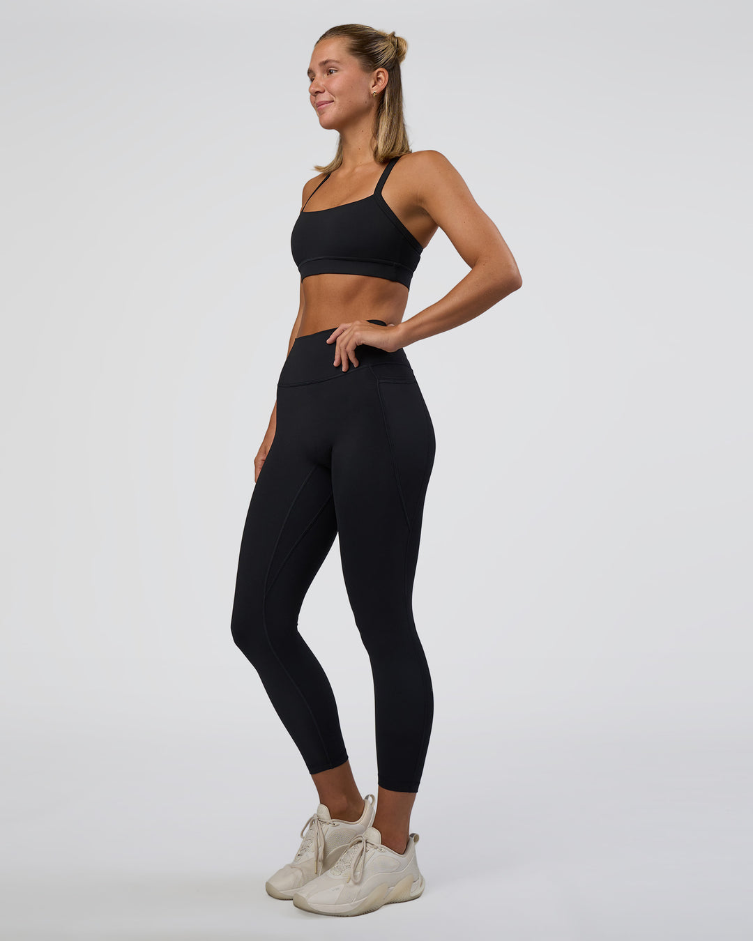 Woman wearing Fusion Ultra High-Rise 7/8 Legging Pockets - Black | Model:Amity | Size:S - view 8
