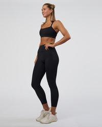 Woman wearing Fusion Ultra High-Rise 7/8 Legging Pockets - Black | Model:Amity | Size:S | Thumbnail Index: 7