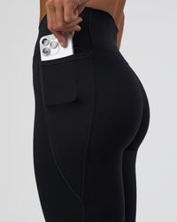 Woman wearing Fusion Ultra High-Rise 7/8 Legging Pockets - Black | Model:Amity | Size:S | Thumbnail Index: 5
