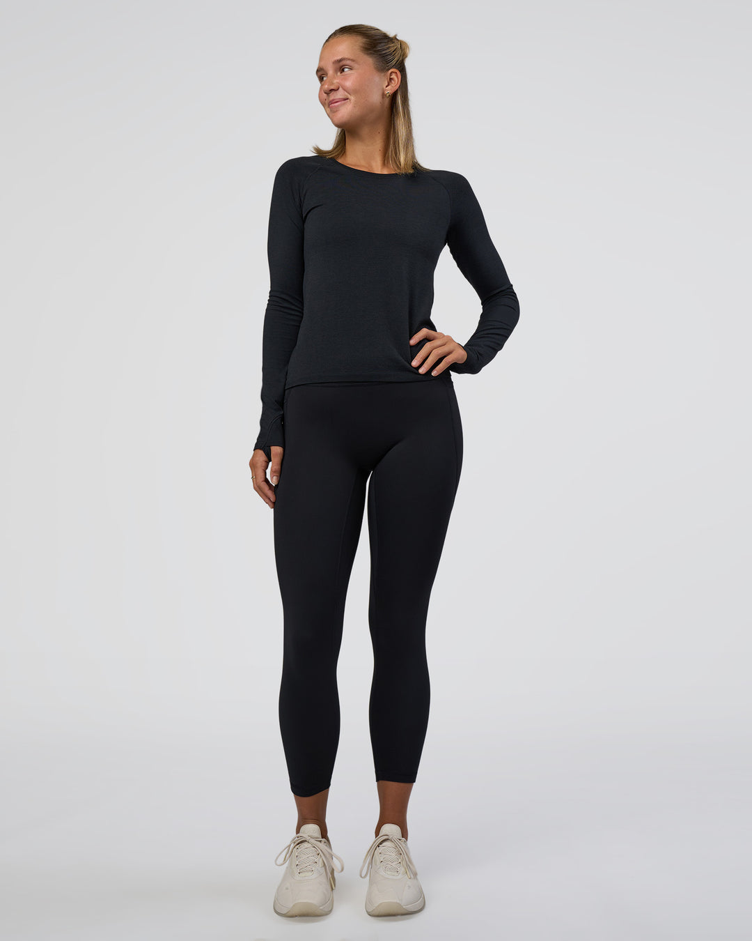 Woman wearing Fusion Ultra High-Rise 7/8 Legging Pockets - Black | Model:Amity | Size:S - view 5