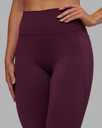Woman wearing Fusion Ultra High-Rise 7/8 Legging Pockets - Cherry Lacquer | Model:Paris | Size:S | Thumbnail Index: 4