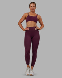 Woman wearing Fusion Ultra High-Rise 7/8 Legging Pockets - Cherry Lacquer | Model:Paris | Size:S | Thumbnail Index: 0