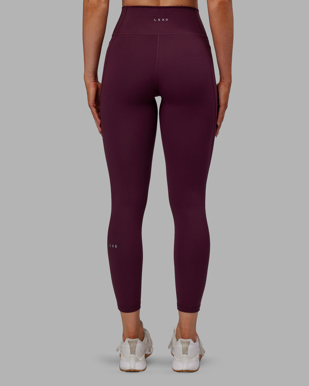 Woman wearing Fusion Ultra High-Rise 7/8 Legging Pockets - Cherry Lacquer | Model:Paris | Size:S - view 4
